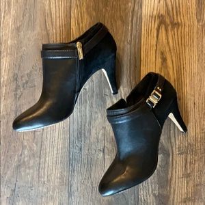 black Vince Camuto booties with gold detail
